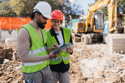 Graphic of two people reviewing a sketch