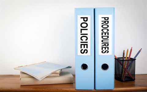 Photo of two binders representing policies and procedures