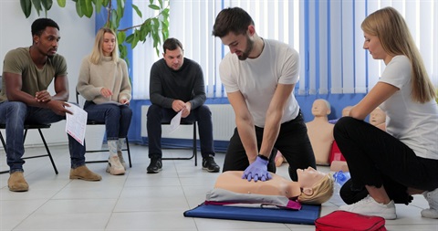 Photo of a Man doing CPR