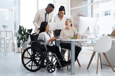 Photo of a group of people with one in a wheelchair