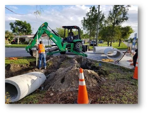 photo of tractor digging up the ground